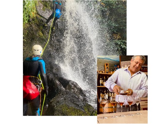 Two adventure travelers rappel down a waterfall, while a local man pours wine for tasting, showcasing both nature and culture experiences in a destination.