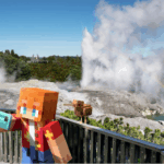 Minecraft-style character standing on a viewing platform overlooking New Zealand’s geothermal landscape, with steaming geysers, turquoise water, and lush greenery in the background.