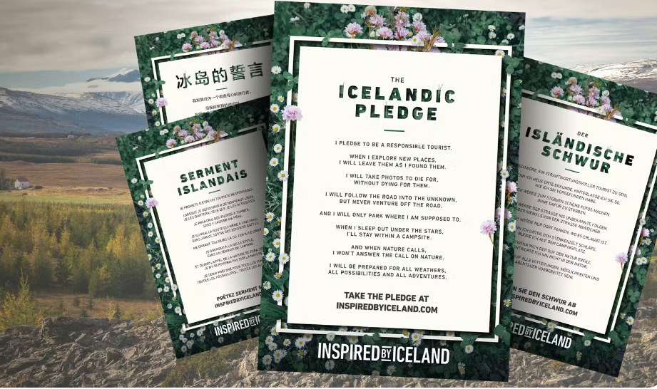 Four illustrated posters titled “The Icelandic Pledge” are displayed in English, Chinese, French, and German against a scenic Icelandic backdrop of mountains, trees, and a small building.