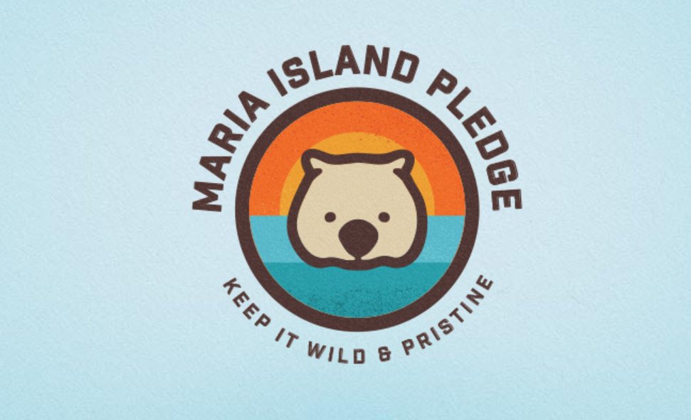 Maria Island Pledge logo featuring a wombat over a sunset and ocean, with the text “Keep It Wild & Pristine.